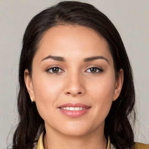 Joyful white young-adult female with medium  brown hair and brown eyes