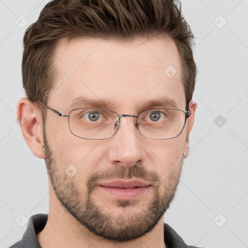 Joyful white adult male with short  brown hair and grey eyes