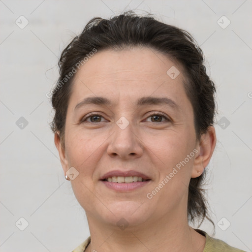 Joyful white adult female with short  brown hair and brown eyes