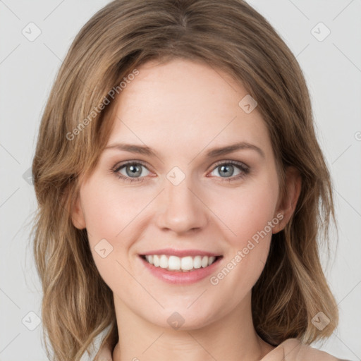 Joyful white young-adult female with medium  brown hair and green eyes