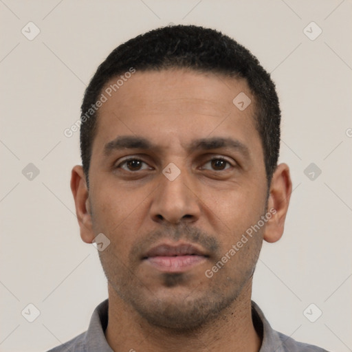 Neutral latino young-adult male with short  black hair and brown eyes