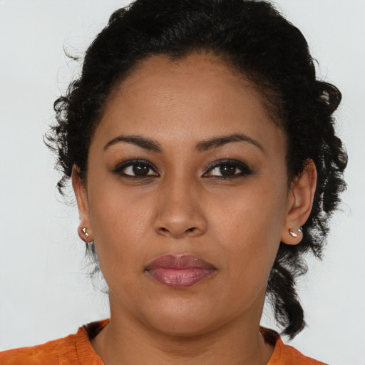 Neutral black young-adult female with short  brown hair and brown eyes