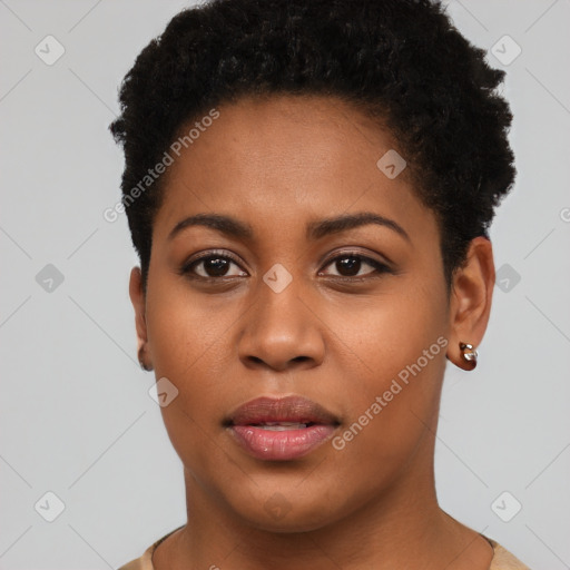 Joyful black young-adult female with short  brown hair and brown eyes