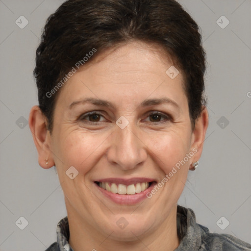 Joyful white adult female with short  brown hair and brown eyes