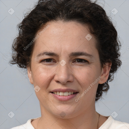 Joyful white adult female with short  brown hair and brown eyes