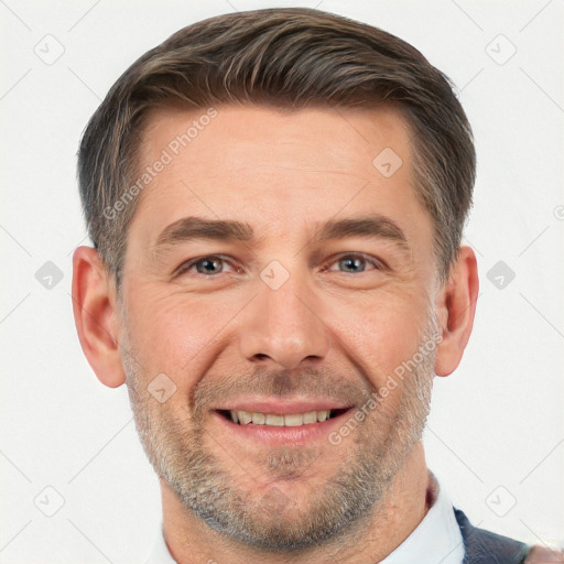 Joyful white adult male with short  brown hair and brown eyes