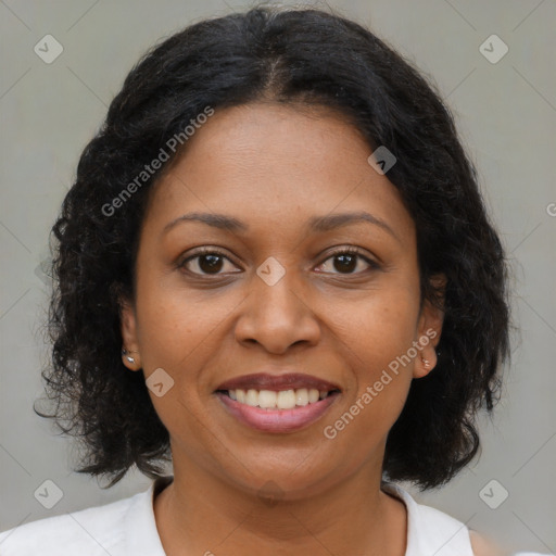 Joyful black young-adult female with medium  brown hair and brown eyes