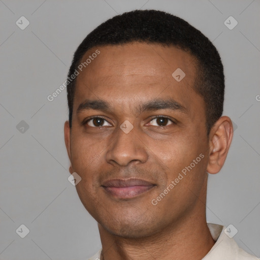 Joyful black young-adult male with short  black hair and brown eyes