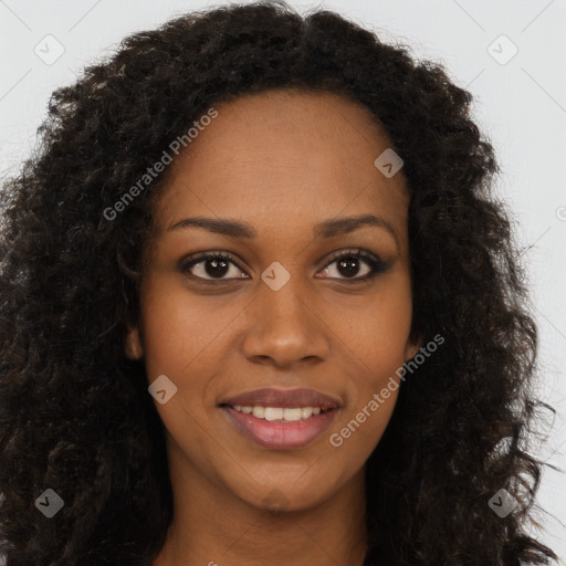 Joyful black young-adult female with long  brown hair and brown eyes