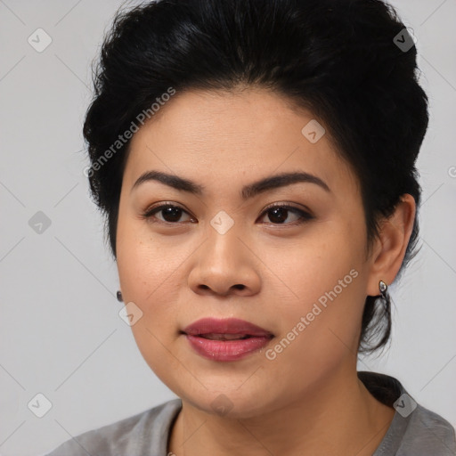 Joyful latino young-adult female with medium  black hair and brown eyes