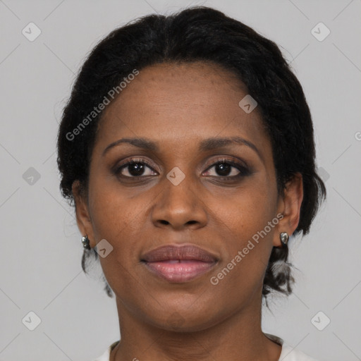 Joyful black adult female with medium  brown hair and brown eyes