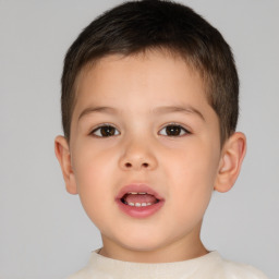 Joyful white child male with short  brown hair and brown eyes