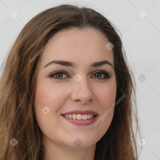 Joyful white young-adult female with long  brown hair and green eyes