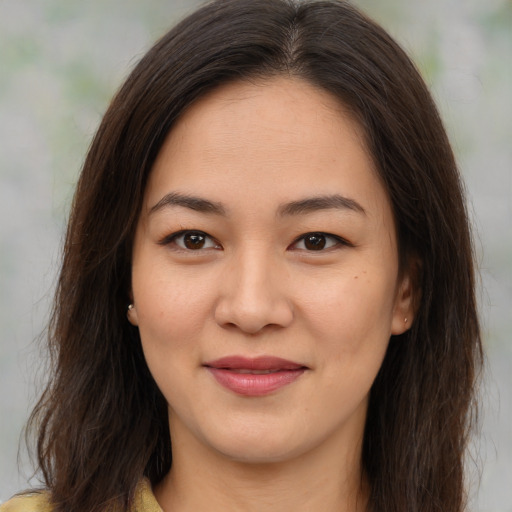 Joyful asian young-adult female with medium  brown hair and brown eyes