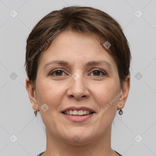 Joyful white young-adult female with short  brown hair and grey eyes