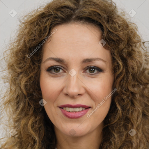 Joyful white adult female with long  brown hair and brown eyes