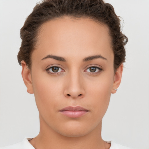 Neutral white young-adult female with short  brown hair and brown eyes