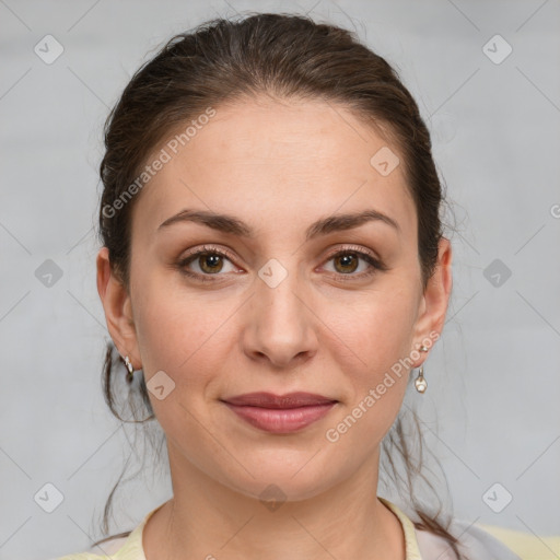 Joyful white young-adult female with medium  brown hair and grey eyes