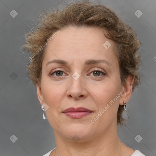 Joyful white adult female with short  brown hair and brown eyes