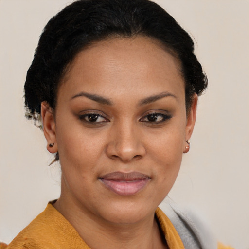 Joyful latino young-adult female with short  brown hair and brown eyes
