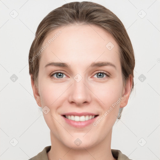 Joyful white young-adult female with medium  brown hair and grey eyes