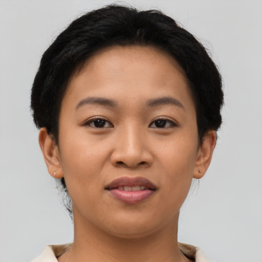 Joyful asian young-adult female with short  brown hair and brown eyes
