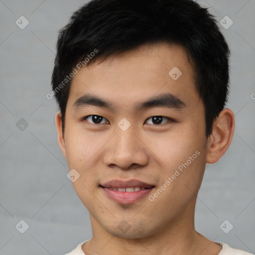 Joyful asian young-adult male with short  black hair and brown eyes