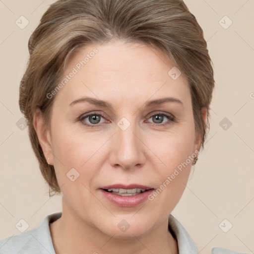 Joyful white adult female with medium  brown hair and grey eyes