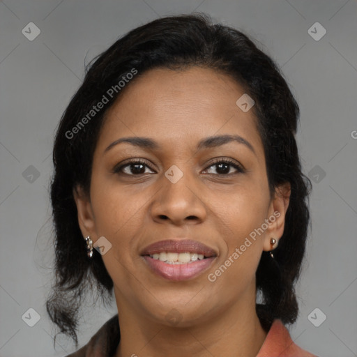 Joyful black adult female with medium  brown hair and brown eyes