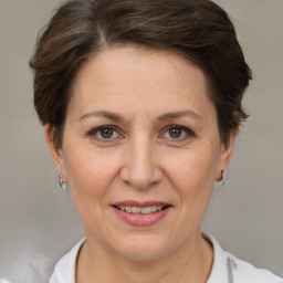 Joyful white adult female with short  brown hair and brown eyes