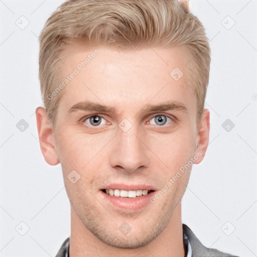 Joyful white young-adult male with short  brown hair and grey eyes