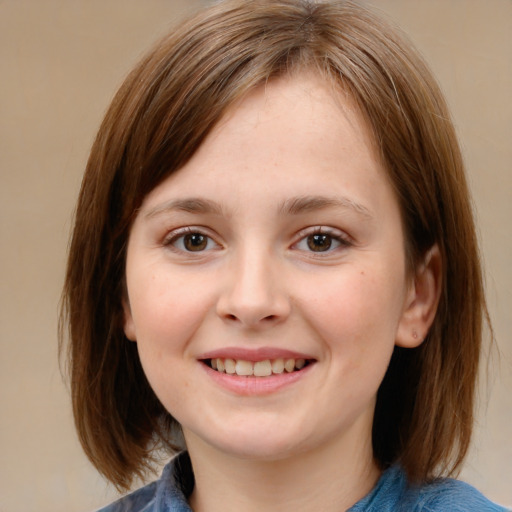 Joyful white child female with medium  brown hair and brown eyes