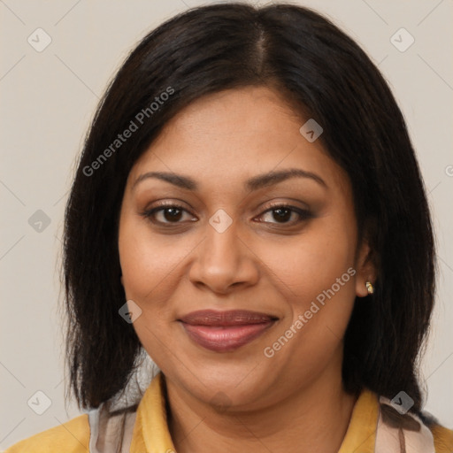 Joyful latino adult female with medium  brown hair and brown eyes