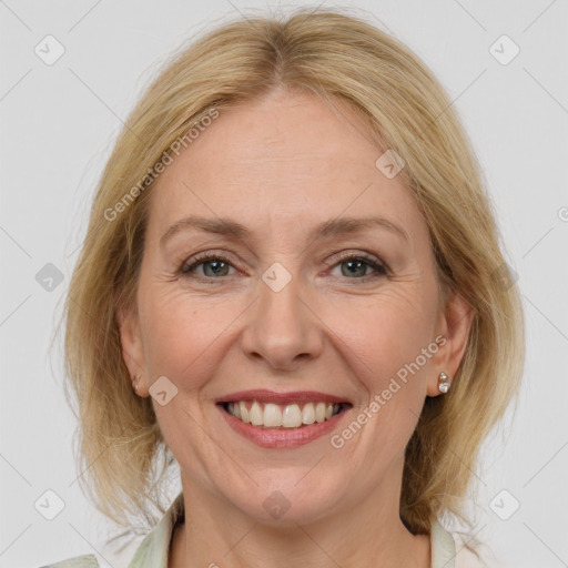 Joyful white adult female with medium  brown hair and grey eyes