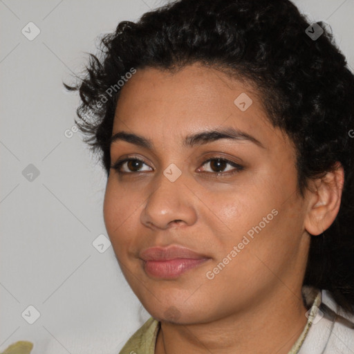 Joyful latino young-adult female with short  black hair and brown eyes