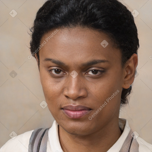 Joyful black young-adult female with short  brown hair and brown eyes