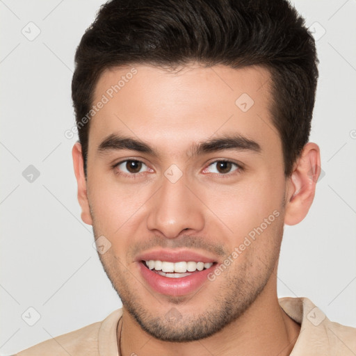 Joyful white young-adult male with short  brown hair and brown eyes