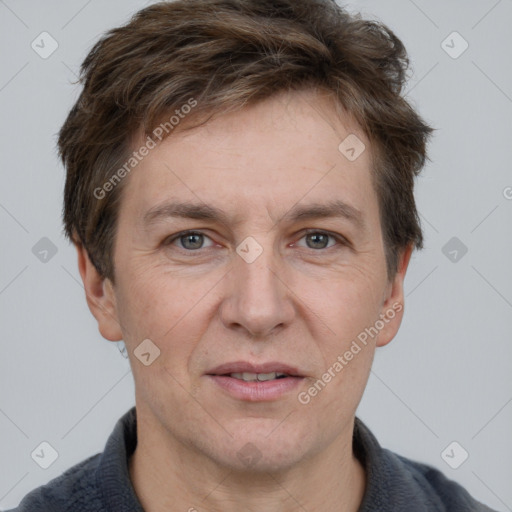 Joyful white adult male with short  brown hair and grey eyes