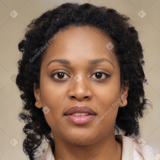 Joyful black young-adult female with long  brown hair and brown eyes