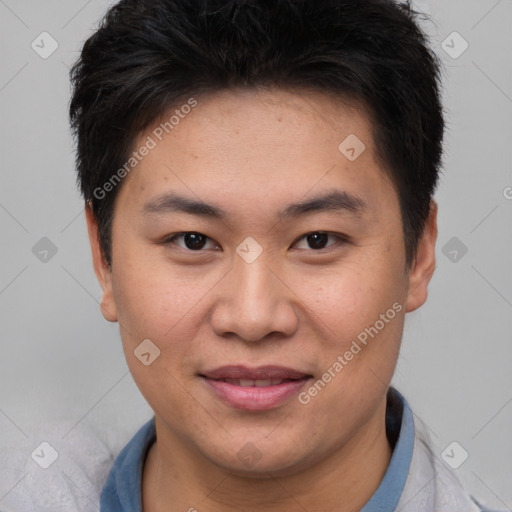 Joyful asian young-adult male with short  brown hair and brown eyes