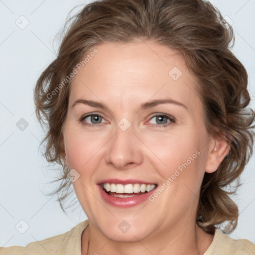 Joyful white young-adult female with medium  brown hair and blue eyes