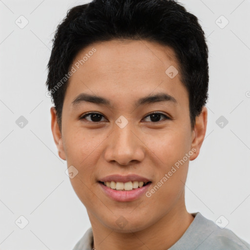 Joyful asian young-adult male with short  black hair and brown eyes