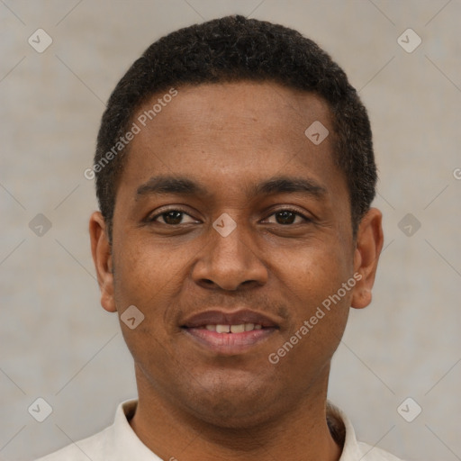 Joyful latino young-adult male with short  brown hair and brown eyes