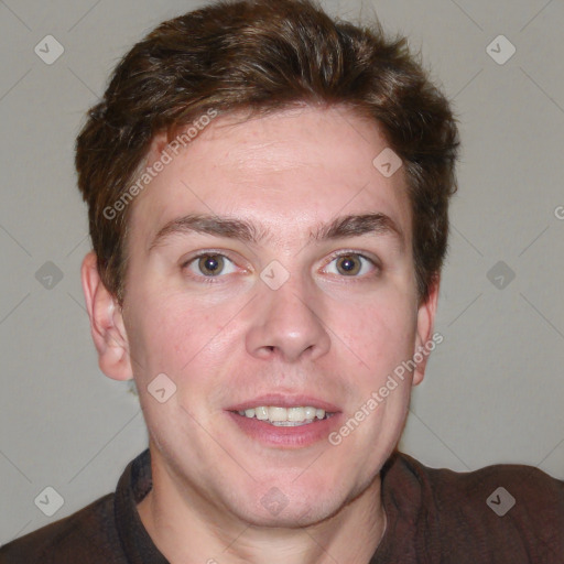 Joyful white young-adult male with short  brown hair and blue eyes