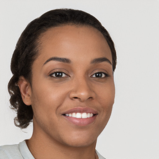 Joyful latino young-adult female with short  brown hair and brown eyes