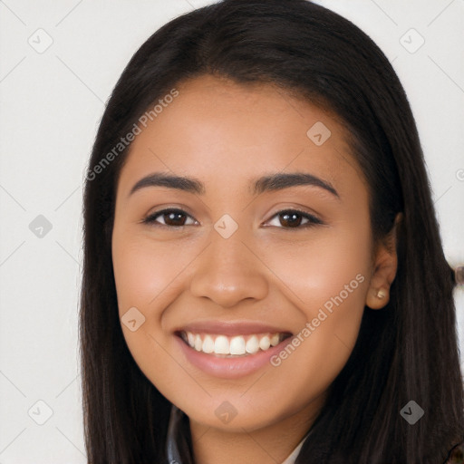 Joyful latino young-adult female with long  brown hair and brown eyes