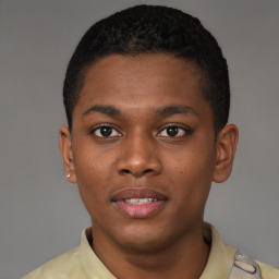 Joyful latino young-adult male with short  brown hair and brown eyes