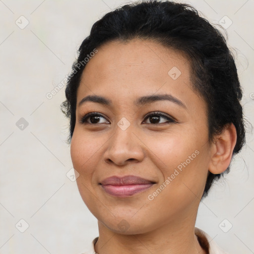 Joyful latino young-adult female with short  brown hair and brown eyes