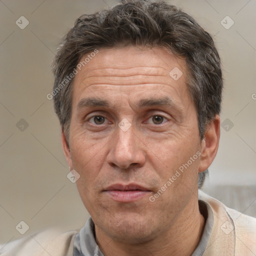 Joyful white middle-aged male with short  brown hair and brown eyes