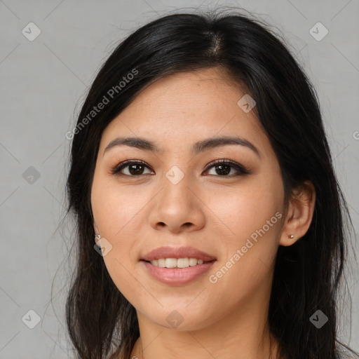 Joyful asian young-adult female with long  brown hair and brown eyes